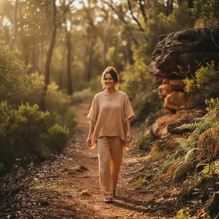 "Woman walking on a bush trail — Recovery & Resilience mushroom supplements"